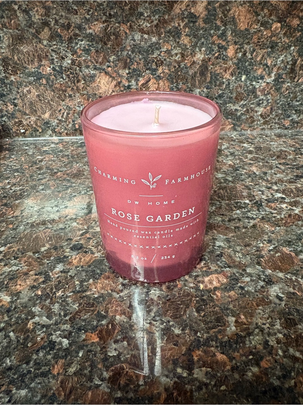 Handmade upcycled candle made by me rose scented wax poured into an upcycled jar